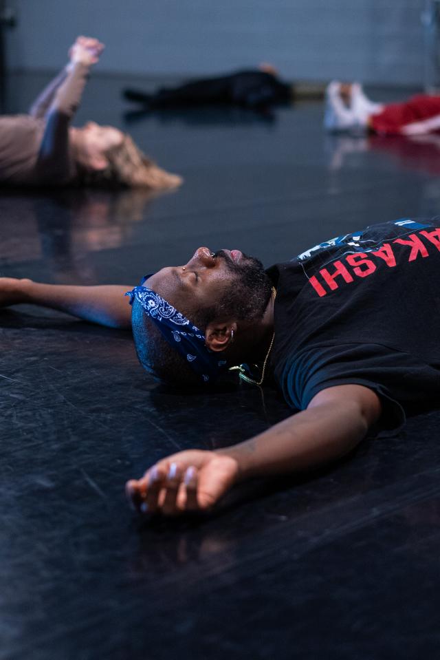 dancers laying on floor