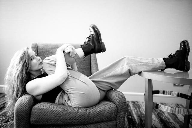 black and white image of girl on chair