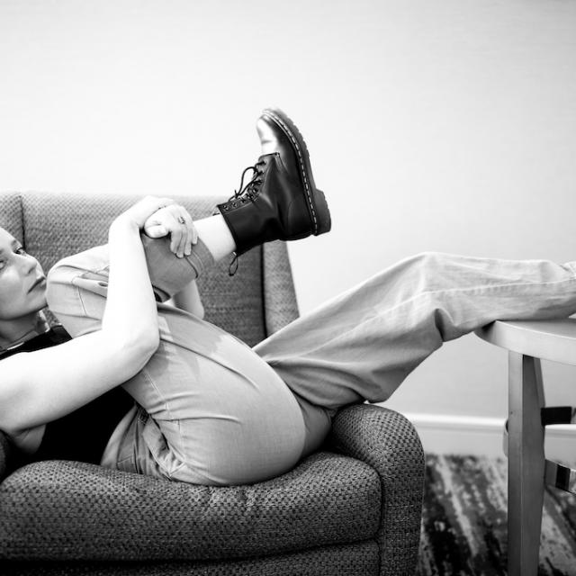 black and white image of girl on chair